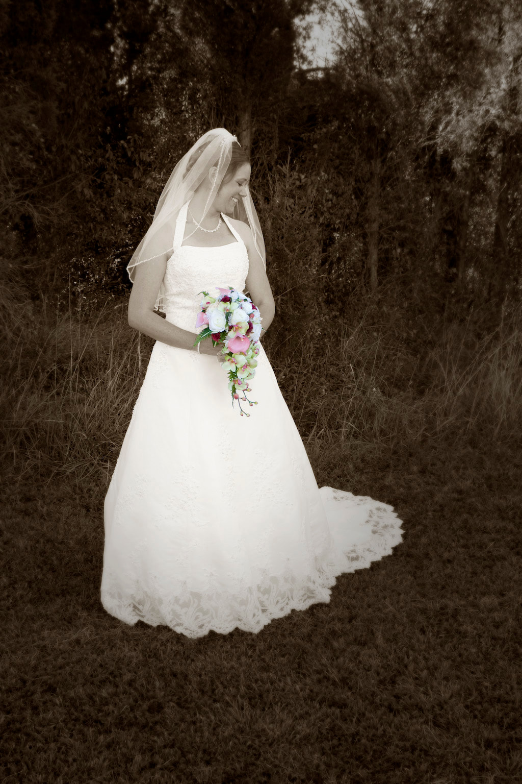 Bride outside black and white with only bouquet in color